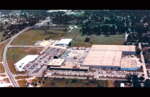 The acreage required for a Wal-Mart store was one of several factors that helped move commercial development from downtown to the edge of town. Shopping malls and the post-WWII car culture also played their roles.