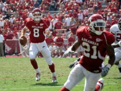 Tyler Wilson threw a touchdown to Michael Smith (21) on his first series as a college quarterback. Things got more difficult from there for Wilson as he experienced his "Welcome to the SEC" moment.