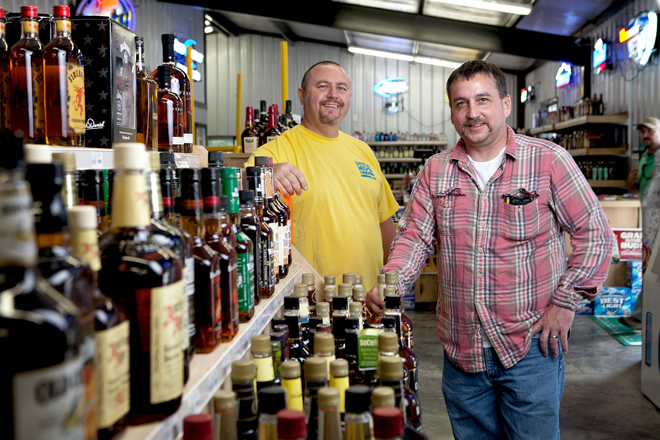 Rodney Hurst, right, and Mitch Pennington own Little Mo's Liquor Store in Gurdon, one of the four package liquor stores permitted in Clark County since voters there decided to "go wet" two years ago.