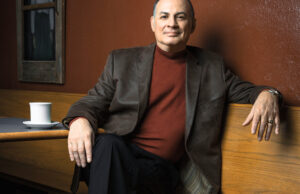 Vincent Insalaco relaxes in a cozy corner of Starving Artist Cafe in Argenta.