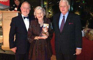 Billie Jean Dougherty, center, of Ward receives AARP Arkansas' 2012 Andrus State Award for Community Service. Presenting the award are, left, Harroll "Hop" Backus, AARP executive vice president of states and communities, and Jim Clemmons, AARP South Central Region Volunteer Director.