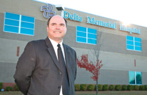 Darren Caldwell is splitting his CEO time between hospitals in Dumas and DeWitt.
