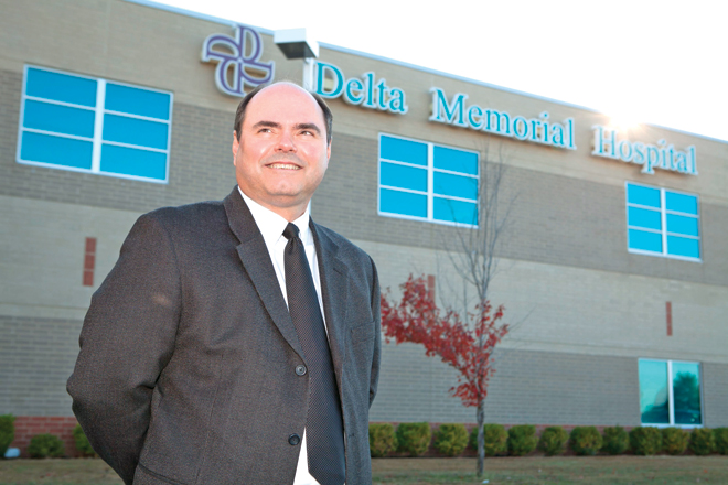 Darren Caldwell is splitting his CEO time between hospitals in Dumas and DeWitt.