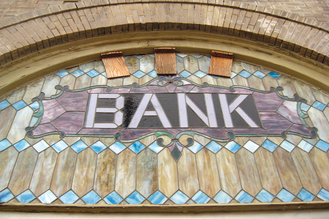 This stained glass window is one clue to the history of an otherwise mostly featureless building in downtown Augusta (Woodruff County).