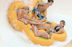 Summer visitors ride the Cyclone at Wild River Country in North Little Rock.