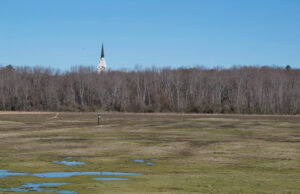 Mulligan&rsquo;s Golf was among the properties assembled by First Pentecostal Church of Jesus Christ, whose steeple is visible in the distance.