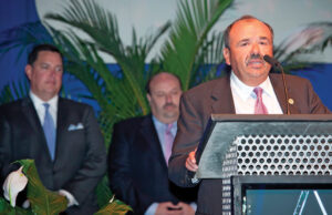 Sam Alley accepts the award as Executive of the Year.