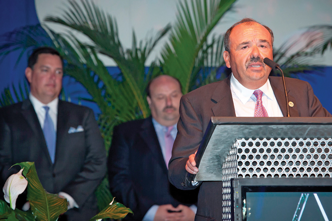 Sam Alley accepts the award as Executive of the Year.