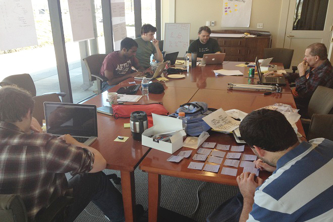 Members of the Simple Service team brainstorm during Startup Weekend Little Rock. Simple Service would go on to win the inaugural event.