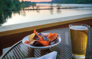 Diners enjoy a sunset on the deck of Cajun's Wharf.