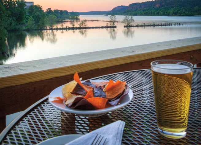 Diners enjoy a sunset on the deck of Cajun's Wharf.
