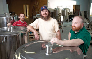 Theron Cash, left, Ian Beard and Shawn Tobin used Kickstarter, a popular crowdfunding platform, to fund a tasting room for the partners&rsquo; Stone&rsquo;s Throw Brewing in Little Rock.&nbsp;