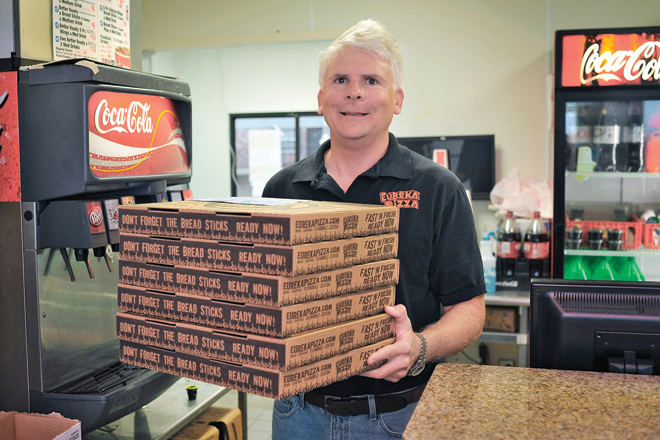 Eureka Pizza owner Rolf Wilkin is having solar panels installed at the Leverett Avenue location in Fayetteville. It could help cut his energy use by between 30 and 50 percent.