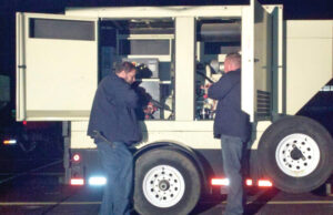 Raymond Biehslich, a senior portable generator technician, works with Shane Young, president of Service Ninjas.&nbsp;