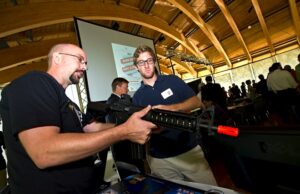 Michael Paladino with Overwatch talks with Will Gilbrech during The ARK Challenge Demo Day at Crystal Bridges Museum of American Art in Bentonville.