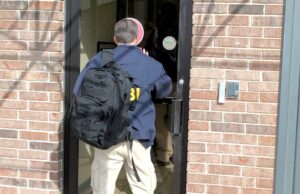 FBI agents conduct an investigation Jan. 28, 2014 at the John Rogers Archive in North Little Rock. The FBI also visited Rogers' home in North Little Rock.