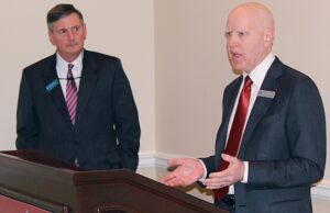 Ross Whipple, left, chairman and CEO of Summit Bancorp. of Arkadelphia, and George Gleason, chairman and CEO of Bank of the Ozarks of Little Rock, speak at a news conference detailing Bank of the Ozark's $216 million deal to buy Summit.