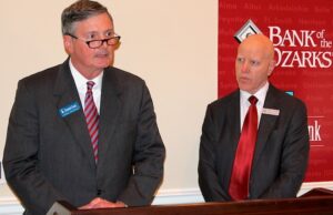 Ross Whipple, left, chairman and CEO of Summit Bancorp. of Arkadelphia, and George Gleason, chairman and CEO of Bank of the Ozarks of Little Rock, speak at a news conference detailing Bank of the Ozark's $216 million deal to buy Summit.