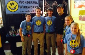 Little Rock orthodontist Andy Vondran poses with Wonderful Wire Works team members at the 2014 YES student business-plan competition. (Photo by Wendy Perry)