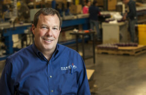 Burt Hanna, CEO of Hanna&rsquo;s Candle, said Wal-Mart&rsquo;s orders increased from $4 million in 2012 to $30 million in 2013. By 2017, Wal-Mart is expected to buy $45 million worth of merchandise from his company that manufactures scented candles in Fayetteville. (Photo by Brooke McNeely Galligan)