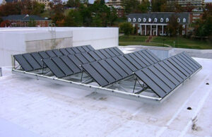 Shown are solar panels installed on HPER building as part of Razors EDGE project at the University of Arkansas. The $30 million project, aimed at improving campus energy use, saved the university 24 percent more than expected in 2012-13.