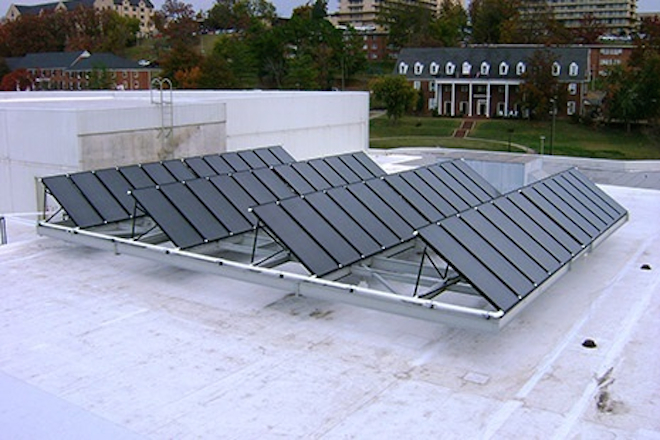 Shown are solar panels installed on HPER building as part of Razors EDGE project at the University of Arkansas. The $30 million project, aimed at improving campus energy use, saved the university 24 percent more than expected in 2012-13.