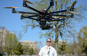 Tim Trieschmann started out using remote airplanes to take still photos. But rotor technology has advanced far enough that it affords superior stability for shooting aerial video, allowing him to find work with film studios and TV stations.