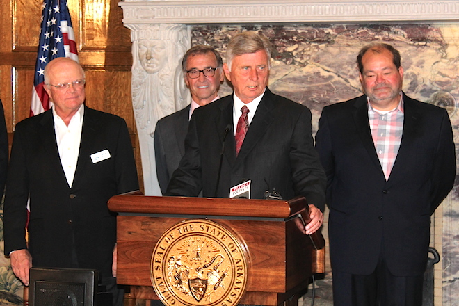 Gov. Mike Beebe at Tuesday's Ben E. Keith announcement. Company President Mike Roach is at far left, and company General Manager Rusty Mathis is at far right.