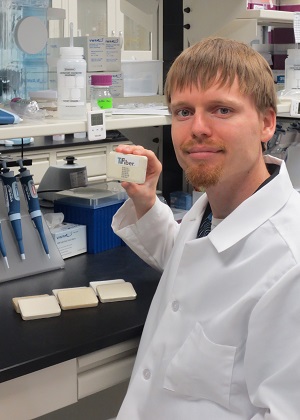 Dr. Mike Rutherford, chief scientist at Fayetteville's TiFiber, displays samples of the bar soap products developed in partnership with Bradford Soap Works.