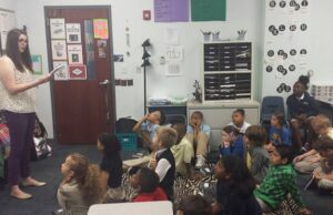 Mandy Ellis, a third grade teacher at eStem Public Charter Schools in Little Rock, practices a model pitch to her students participating in the Noble Impact program.