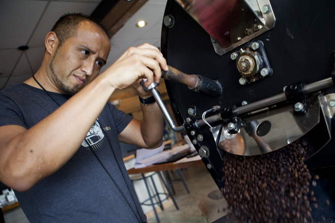 Geovanni Leiva, co-founder of Leiva&rsquo;s Coffee, roasts a batch of coffee beans. | (Photo by Wil Chandler)