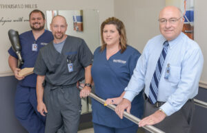 Chris, from left, Mike, Tonya and Gary Horton work at helping amputees and patients suffering from scoliosis and other disorders live a more active life. | (Photo by Mauren Kennedy)