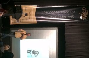 New York designer/artist James Victore speaks to a packed house at the Argenta Community Theater on the opening day of the 2014 Made by Few conference.