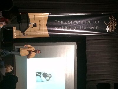 New York designer/artist James Victore speaks to a packed house at the Argenta Community Theater on the opening day of the 2014 Made by Few conference.