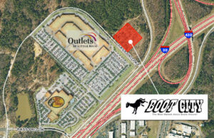Boot City will develop the parcel shaded in red adjacent to the Gateway Town Center in Little Rock. | (Aerial photo by PAGIS)