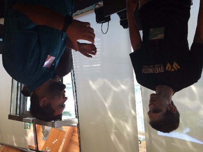 Overwatch CEO Josh Moody talks startups with Springfield, Mo., entrepreneur Jeremy Bartlett at Thursday's ARK Challenge Demo Day in Bentonville.