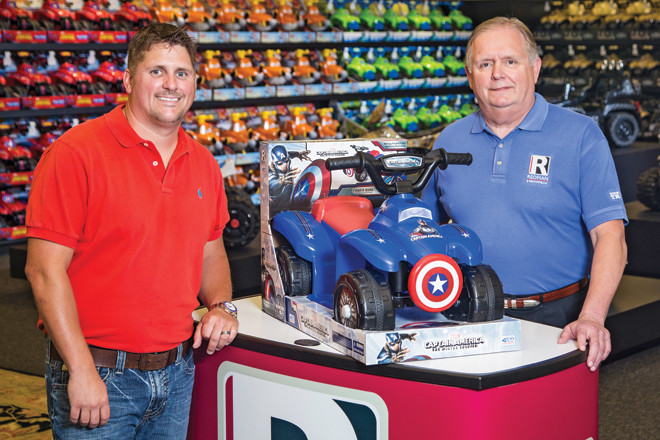Rodney Redman, president and chief operating officer, stands with Mel Redman, chairman and chief executive officer, in Redman & Associates’ home office.  The CEO has  weathered a lawsuit and bankruptcy. | (Photo by Beth Hall)