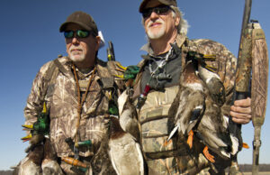 Stan Jones (right), on a hunt with Mike Morgan, is a farmer, conservationist and former college football player who represents five generations of family who farmed and hunted the Clover Bend area.