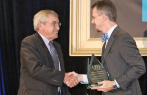 Publisher Mitch Bettis, right, congratulates Don R. Smith of Thomas & Thomas LLP of Little Rock on receiving the Lifetime Achievement in Accounting Award.