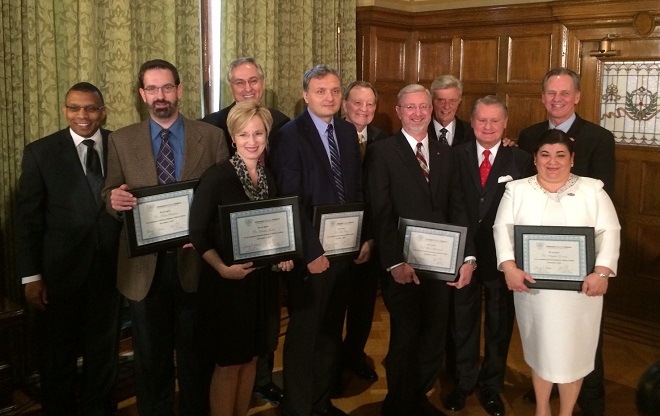 Posing for a group shot after Wednesdfay's announcement of the ARA Fellows program were (from left) UAPB chancellor Laurence Alexander, ARA Fellow Trace Peterson, ARA Fellow Laura James, UAMS chancellor Dan Rahn, ARA Fellow Alexandru Biris, UALR chancellor Joel Anderson, ARA Fellow Alan Mantooth, Gov. Mike Beebe, UA chancellor David Gearhart, ARA Fellow&nbsp;Argelia Lorence and ASU chancellor Tim Hudson.