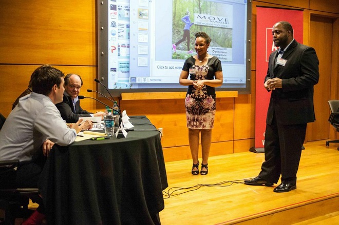 Leah Patterson and Bryan Smith, co-founders of Little Rock's Move Makeup, listen as AVC mentors John Murdock (left) and James Hendren provide feedback at the inaugural Pre-Flight program Pitch Day.