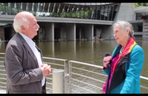 Architect Moshe Safdie discusses his vision of Crystal Bridges Museum of American Art with its founder, Alice Walton. | (Screenshot courtesy of the Crystal Bridges YouTube channel.)