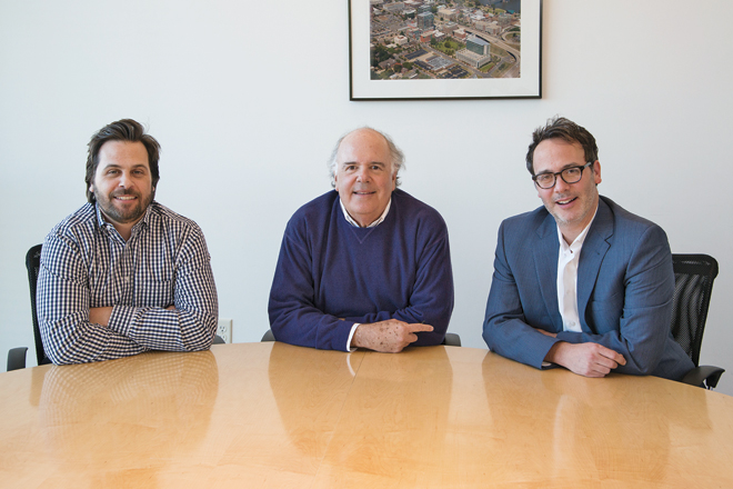 Chris Moses, left, and brother, Jamie, with their father, Jimmy, the founder of Moses Tucker Real Estate. Jimmy Moses&rsquo; partner, Rett Tucker, says they&rsquo;re both interested in planning for the future. | (Photo by Jason Burt)