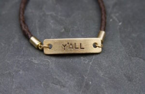 The braided leather "Y'all" bracelet, part of the new Bourbon & Boots by Dillard's line.