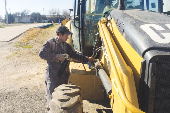 Maintenance at Bearskin Farms, one of many state operations using enhanced, on-site grain storage to improve marketing positions.