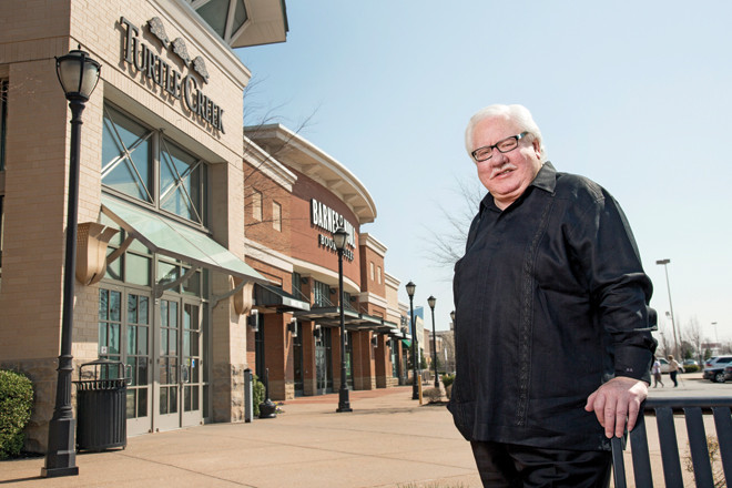Bruce Burrow poses with his retailing baby, The Mall at Turtle Creek.  Financial setbacks led to a sale of the landmark Jonesboro project he long envisioned, but the mall remains a source of pride.