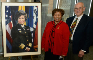 Former U.S. Surgeon General Dr. Joycelyn Elders with Dr. Tom Bruce, inaugural dean of the University of Arkansas for Medical Sciences Fay W. Boozman College of Public Health, at the unveiling of the portrait commissioned in her honor by the college&rsquo;s advisory council.