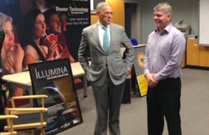Fred Hochberg (left), chairman and president of the Export-Import Bank of the U.S., and Power Technology Inc. VP William Burgess talk exports and PTI's new Illumina laser projection system during Hochberg's Tuesday tour of the PTI facility in Alexander.