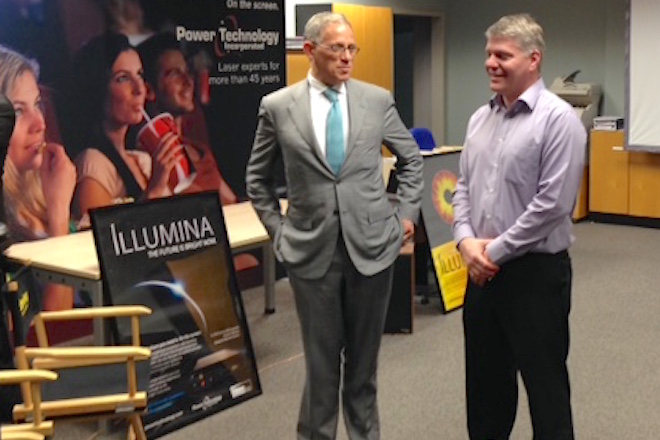 Fred Hochberg (left), chairman and president of the Export-Import Bank of the U.S., and Power Technology Inc. VP William Burgess talk exports and PTI's new Illumina laser projection system during Hochberg's Tuesday tour of the PTI facility in Alexander.