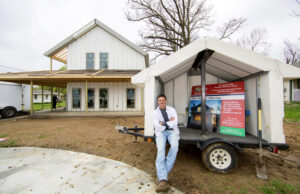 Jimmy Rapert in the front yard of an energy-efficient, EPS-using 1,700-SF home he is building in Johnson (Washington County).